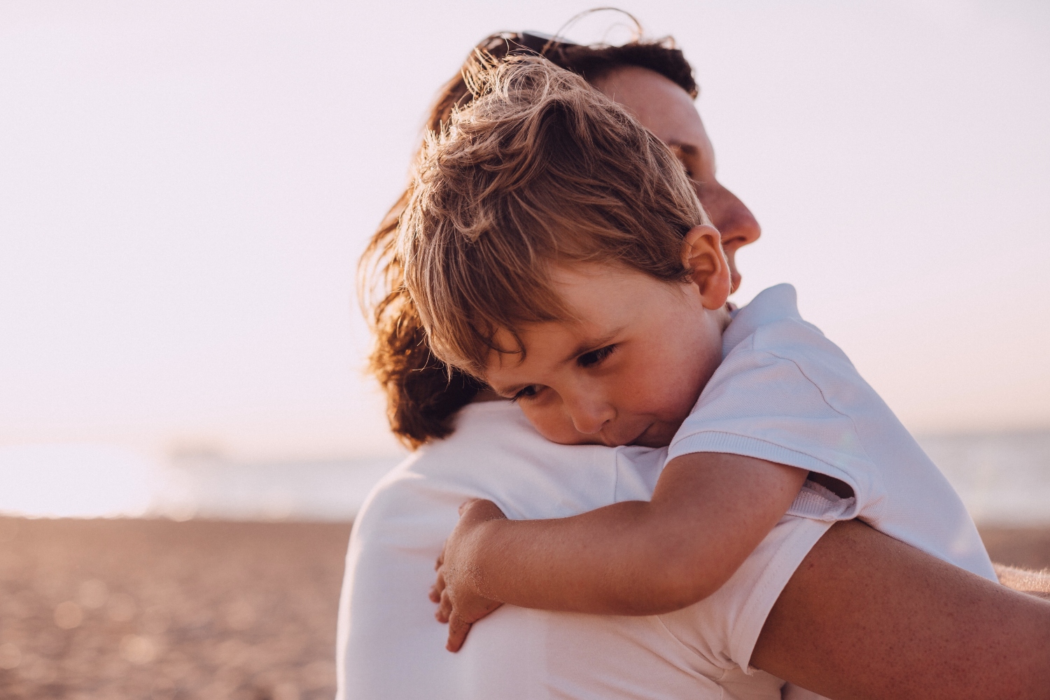 Boy hugging mother