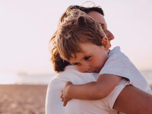 Boy hugging mother